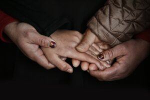 3 generations holding hands